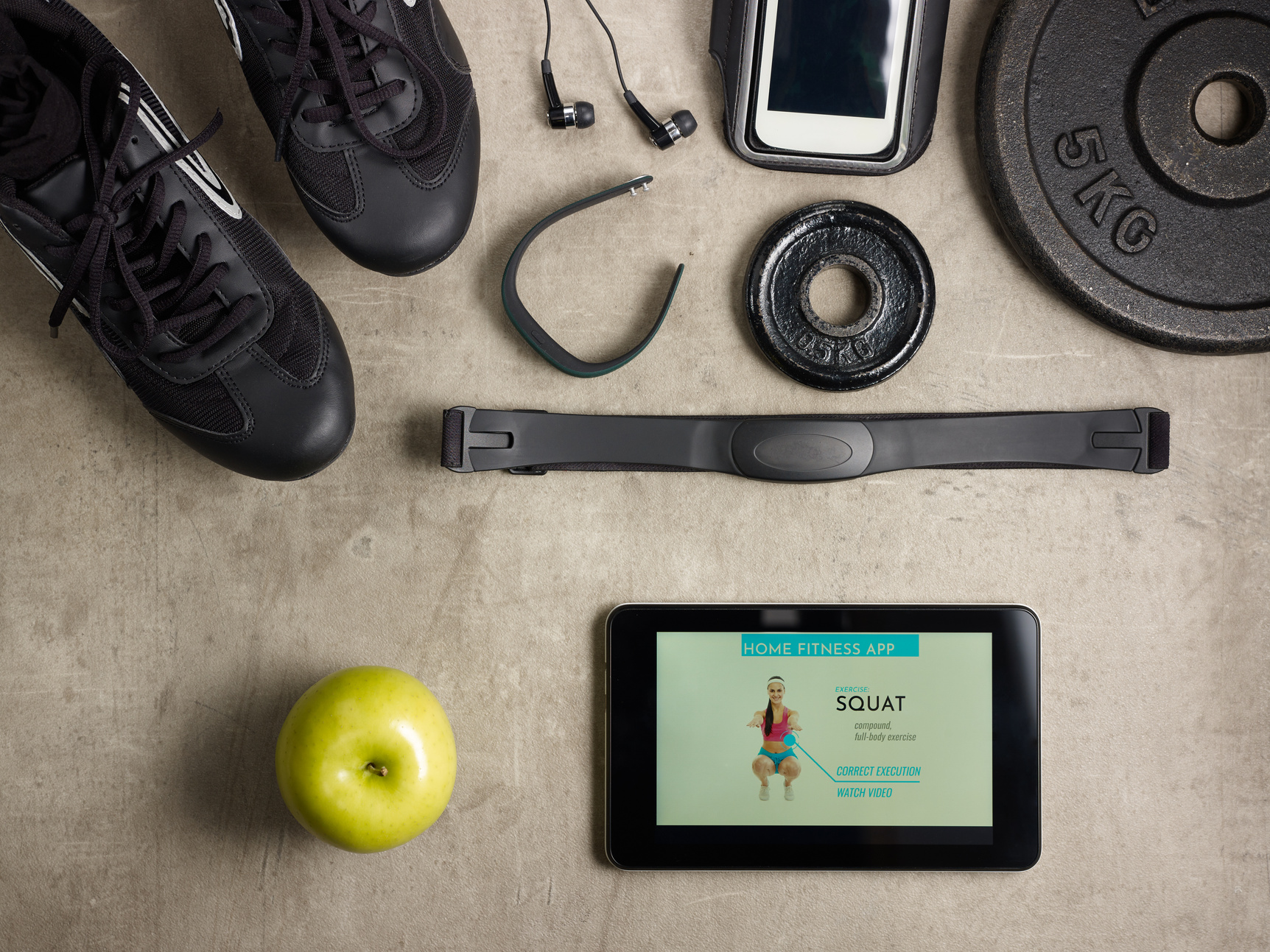 sneakers, hear rate monitor and tablet PC with fitness app